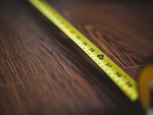 Contractor measuring their floor